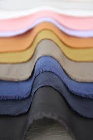 Stack of fabrics in a range of colours